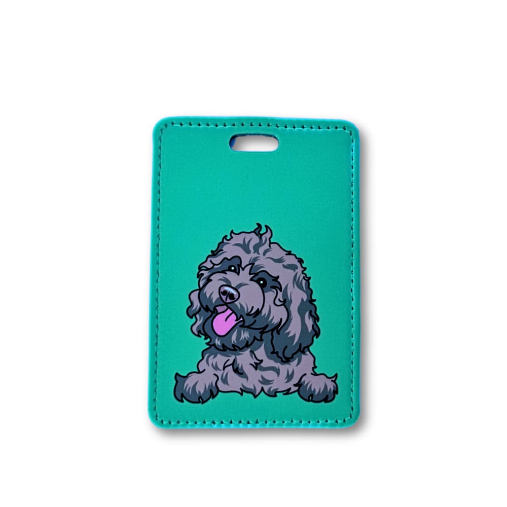 dark brown cavapoo luggage tag; illustrated dog on green background.