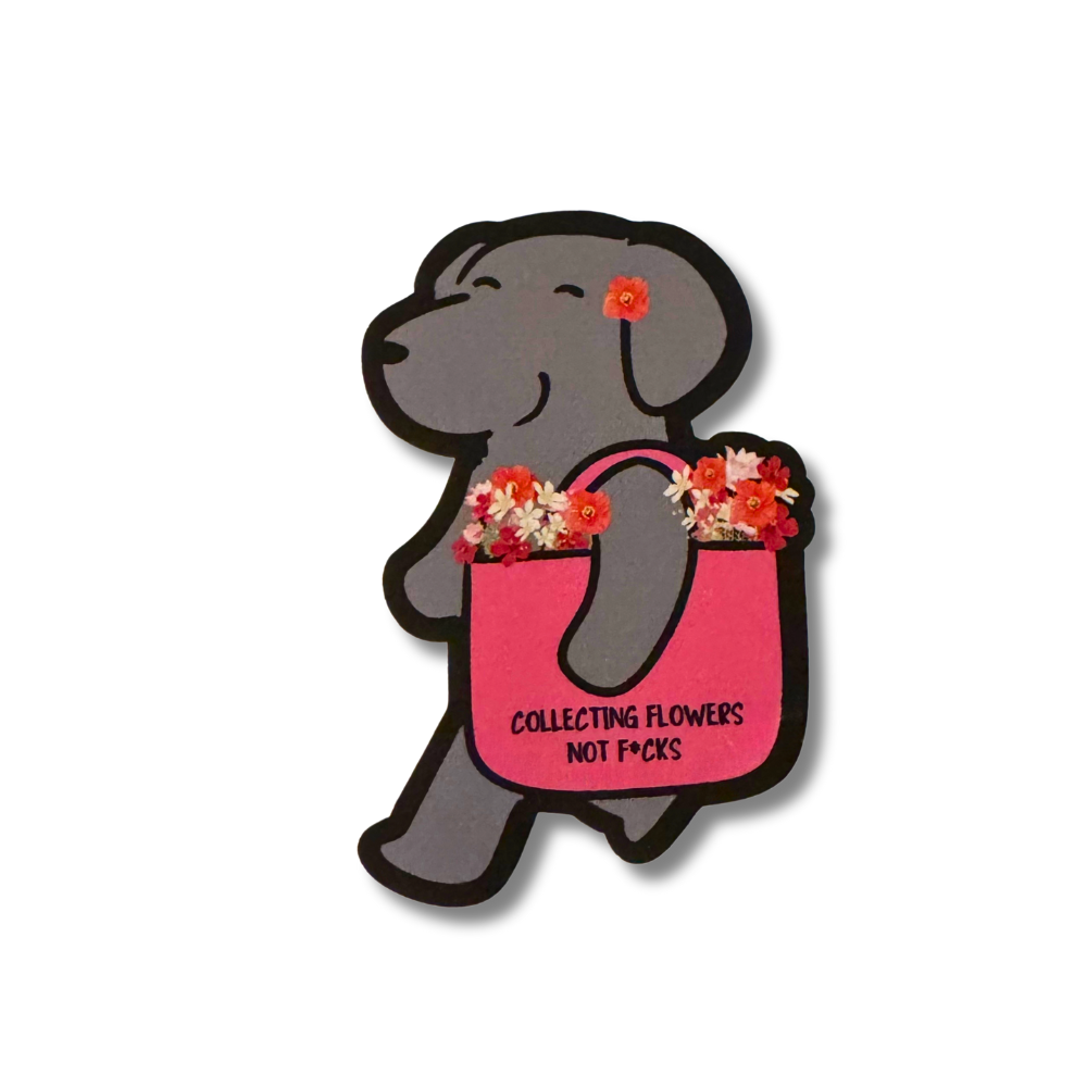 Gray cartoon dog sticker with flowers in a pink tote bag that says âCollecting Flowers Not F*cks.â Funny waterproof vinyl dog sticker.