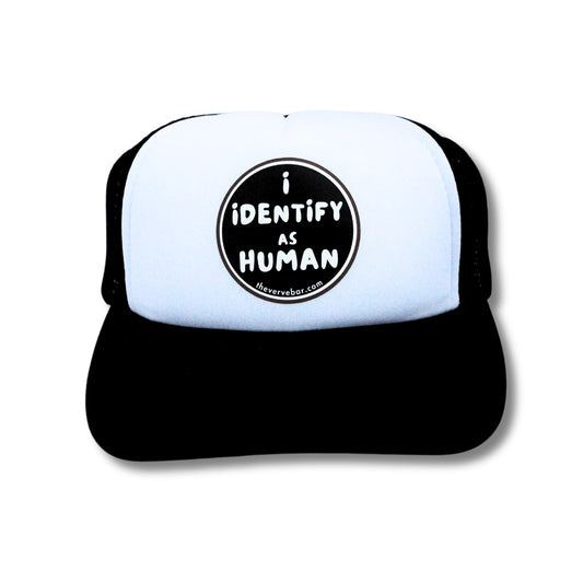 Black and white best dog hat with 'i identify as human' text on a white background