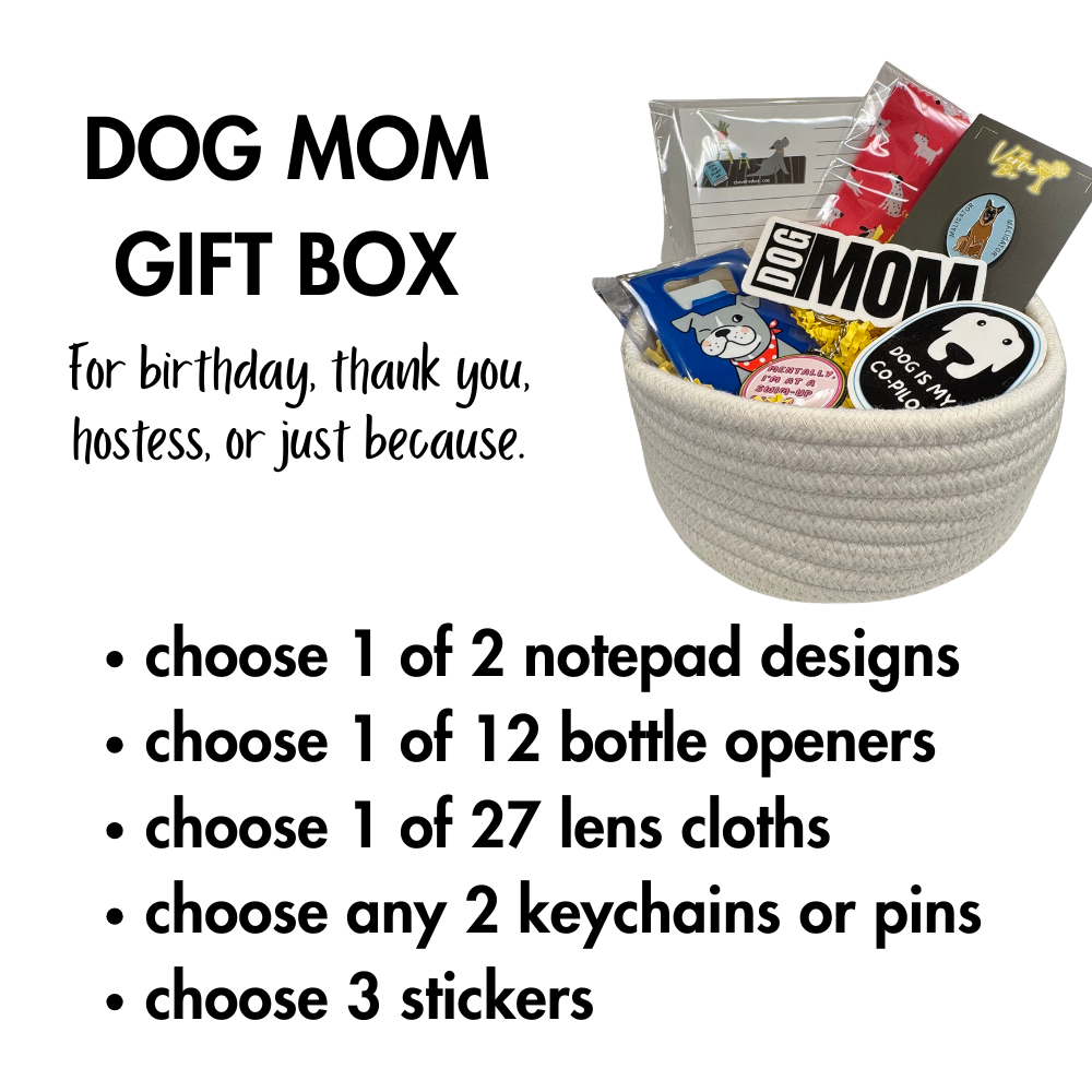 Dog mom gift box filled with stickers, keychains, dog notepad, bottle opener, and lens cloth