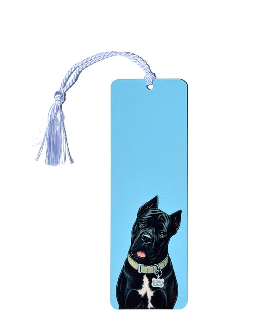 Cane Corso bookmark on white background, sky blue aluminum with black Cane Corso artwork and Slobber Slinger collar tag, white tassel