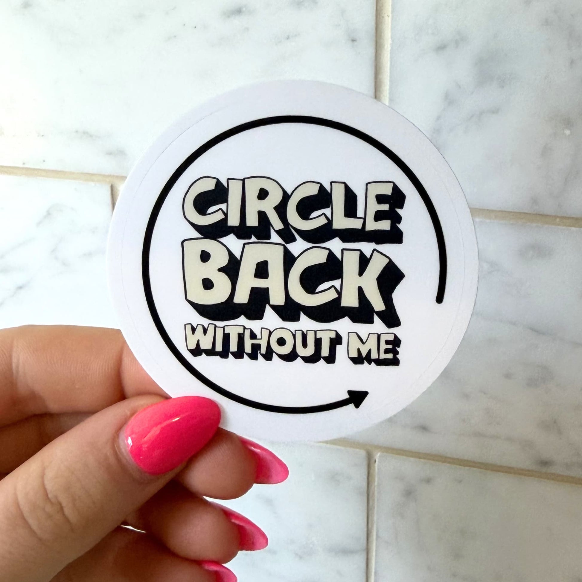Circle back without me sticker: Circular sticker with butter colored letters 'Circle Back Without Me' text on a white background ... held by a hand to show size