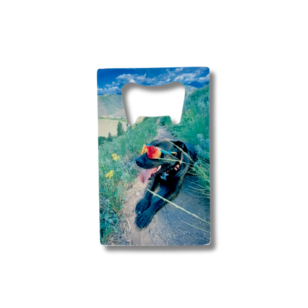 Custom pet photo bottle opener with black dog wearing sport sunglasses on a mountain trail; stainless steel wallet size