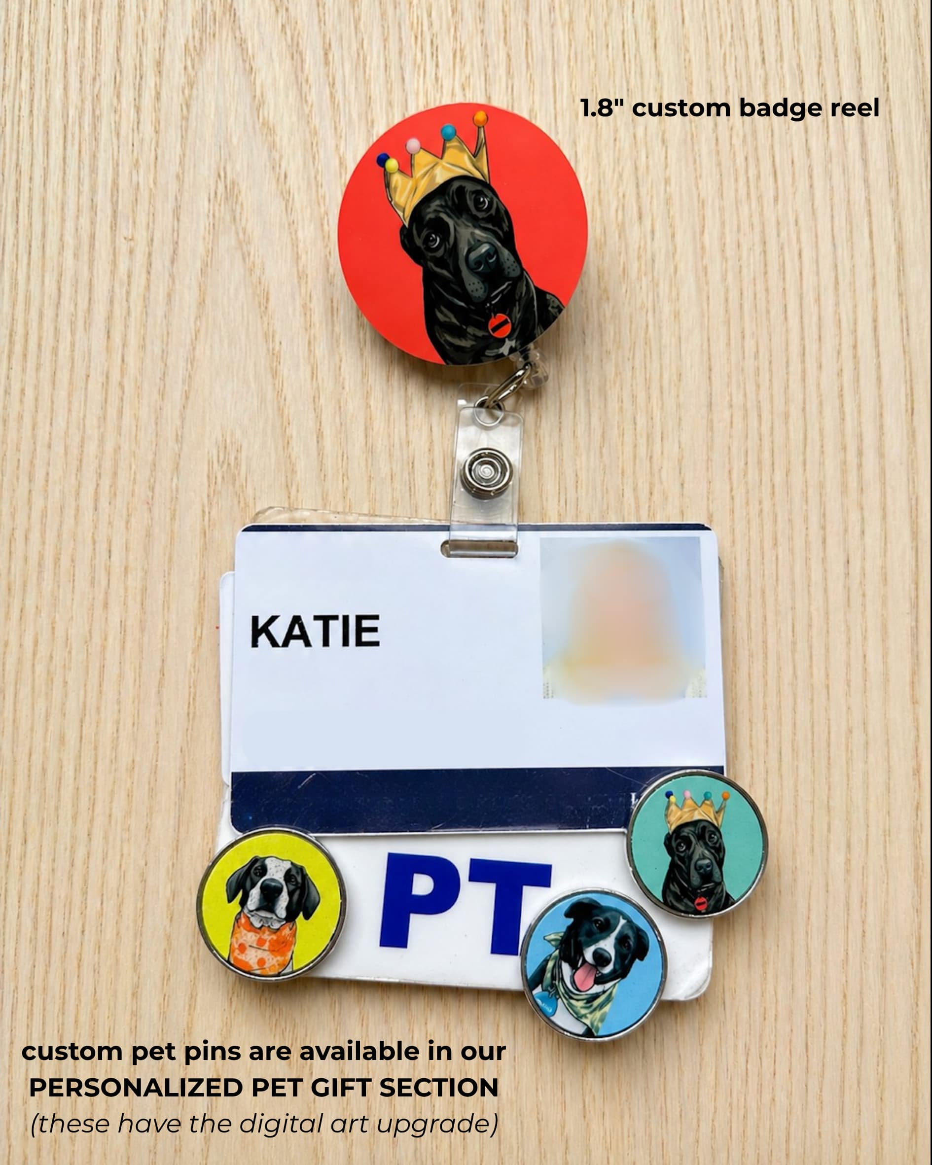 Custom pet badge reel lifestyle, large alligator clip swivel retractable badge reel with illustrated black dog wearing crown clipped to PT badge holder with custom pet pins, on wood desk.