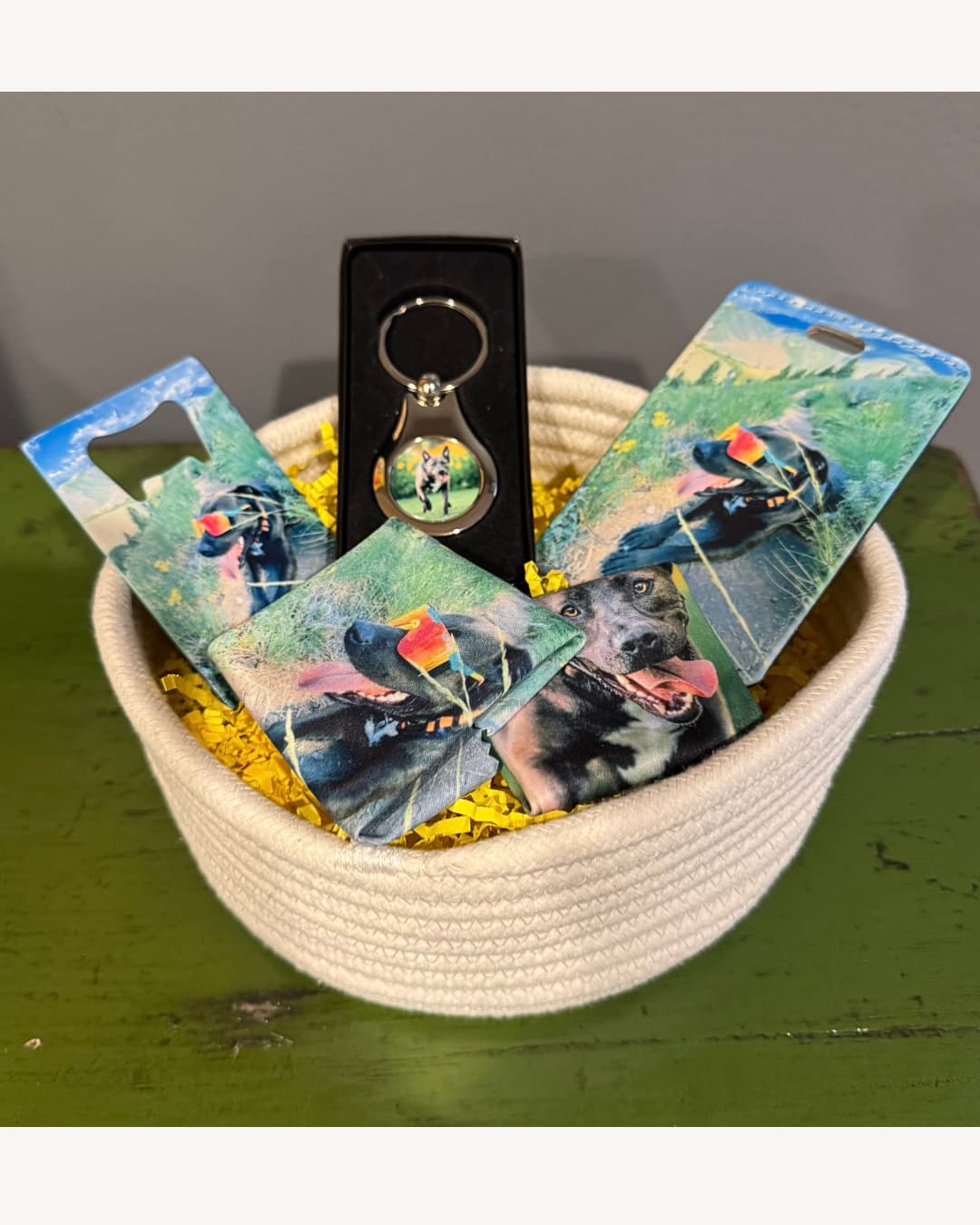 custom dog gift box in a white cotton rope basket showing personalized pet photo accessories with a brown dog wearing sunglasses