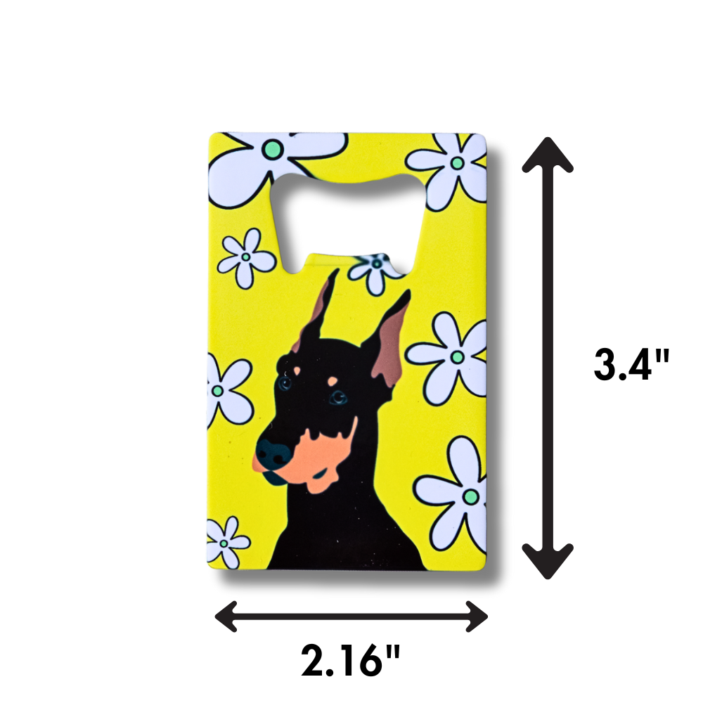 Bottle opener with a doberman dog design on a yellow background with flowers, showing measurements.