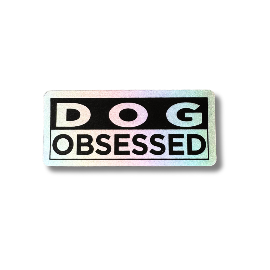 Dog Obsessed matte holographic sticker showing iridescent sheen on black and white rectangular decal