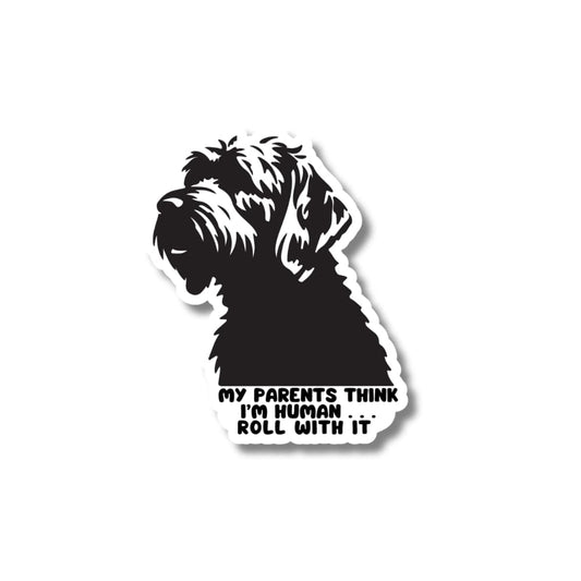 Doodle dog sticker. Dark Gray and white illustration of dog with caption: my parents think I'm human, roll with it."