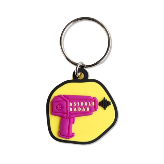funny dog collar charm or backpack charm with yellow background and dark pink radar gun that says "a-hole radar"
