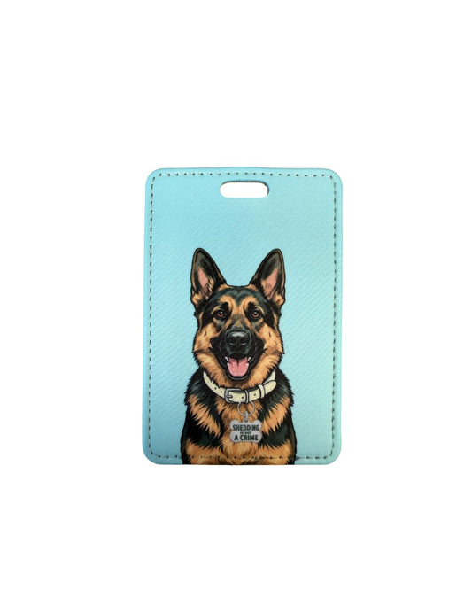 Funny German Shepherd luggage tag; Fun faux leather luggage tag with a wide-eyed grinning German Shepherd illustration wearing a Problem Child collar charm, light blue and white background, white surface.