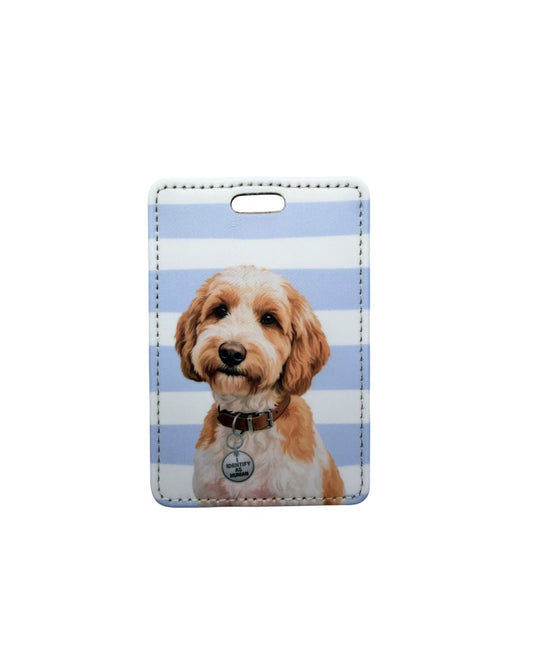 Funny Labradoodle luggage tag; Fun faux leather luggage tag with a fluffy wide-eyed Labradoodle illustration wearing an Identify as Human collar charm, light blue and white horizontal stripes, white background.