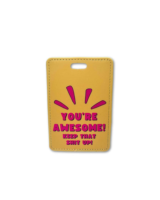 Bright orange-ish yellow suitcase tag with hot pink words: YOU'RE AWESOME, KEEP THAT SHIT UP (and lines coming up to accentuate the words)