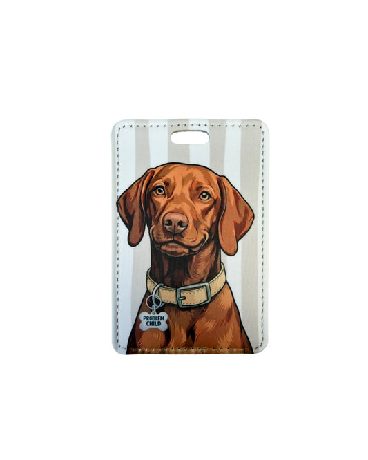 Funny Vizsla gift luggage tag; Faux leather luggage tag with a smug Vizsla illustration wearing a Problem Child funny bone charm, tan and white vertical stripes, white background.