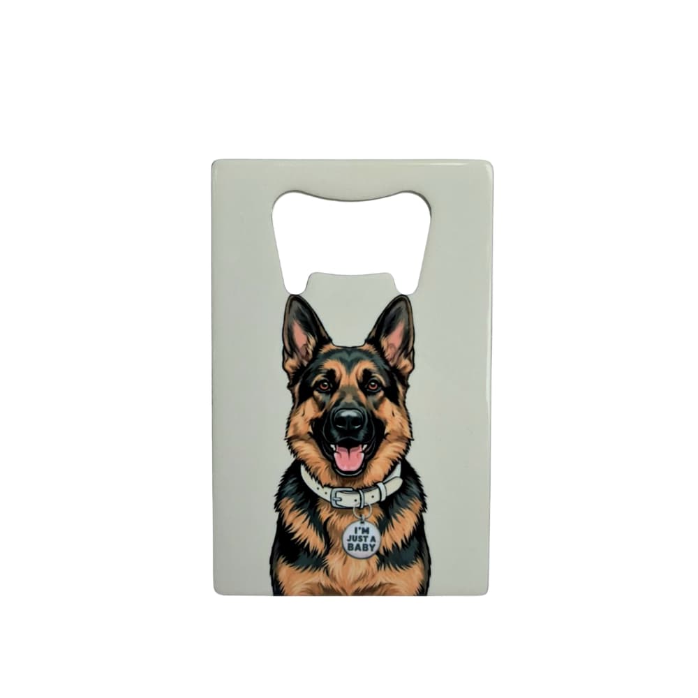 German Shepherd bottle opener; a flat stainless steel bottle opener featuring a GSD with an I'm Just A Baby collar tag against a light gray background.