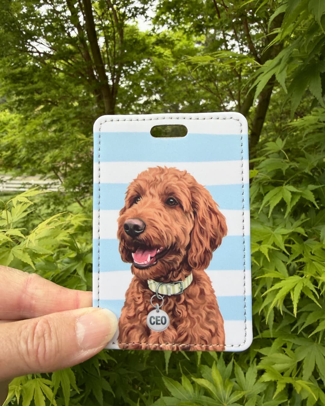goldendoodle luggage tag funny dog handheld showing curly red doodle with CEO collar tag on blue and white striped faux leather tag