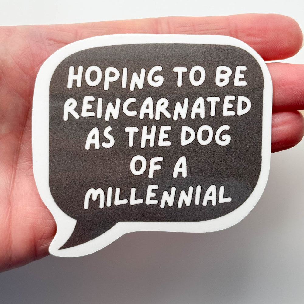 funny millennial dog sticker against a hand to show side comparison