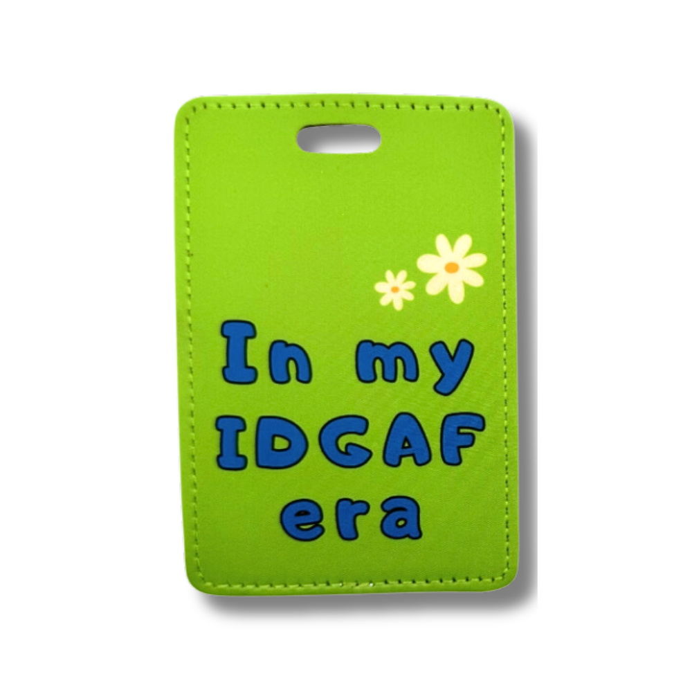 funny travel luggage tags "In my IDGAF era"  green with blue letters and two white daisies 