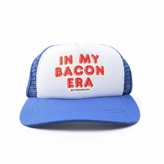 Bacon lover dogs hat; blue and white In My Bacon Era dog trucker hat, front view on white background.