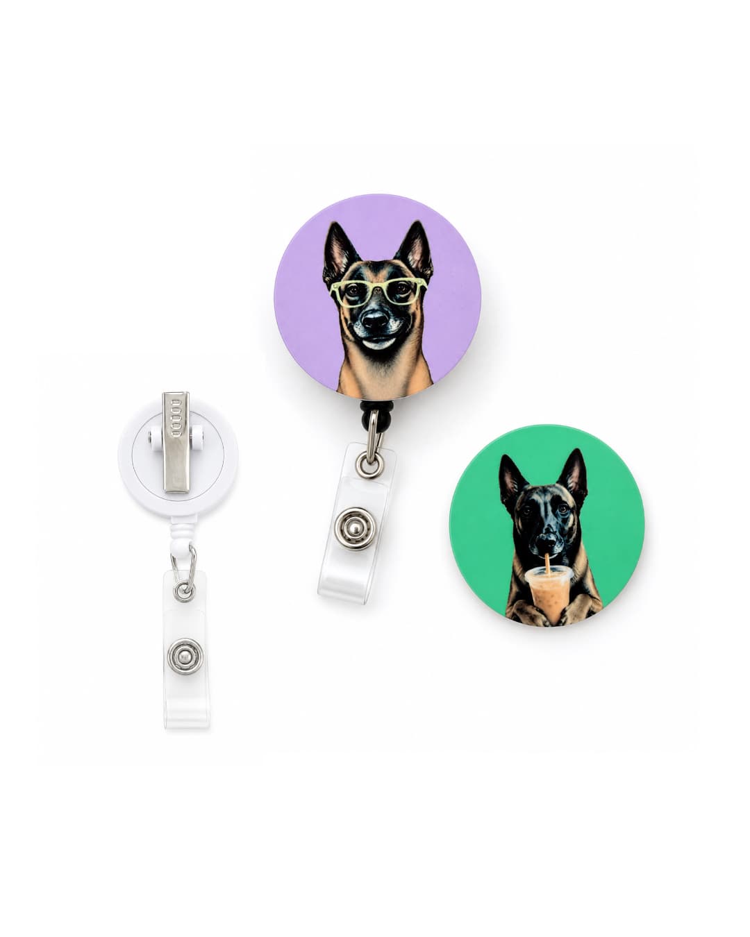 Interchangeable custom pet badge reel set shown with an extra replacement reel, including lavender Belgian Malinois with glasses disc on reel, teal Belgian Malinois with iced coffee disc, and blank white replacement reel
