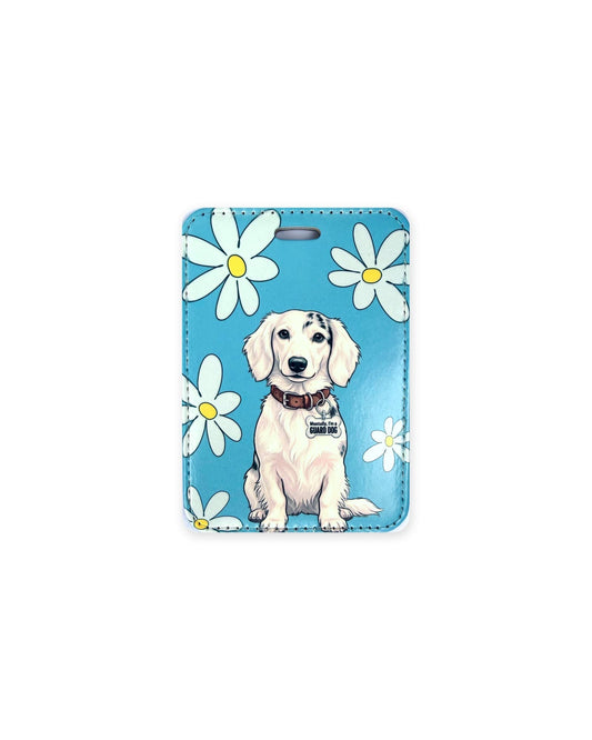 Long haired piebald dachshund luggage tag, white doxie with black patches and a "Mentally, I'm a Guard Dog" charm on blue with white daisies.