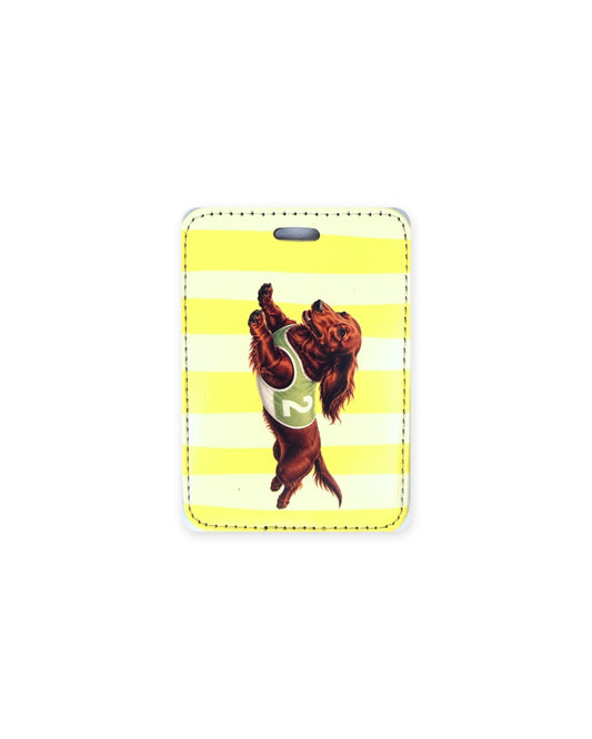 Long haired red racing dachshund luggage tag showing an original design of a long haired red doxie leaping in a green racing vest with the number 2, on yellow and white stripes. Faux leather luggage tag with stitched edges and a slot at the top.