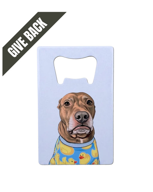 Opie Wallet Bottle Opener, white stainless steel flat bottle opener featuring Opie the pit bull in rubber duck pajamas on light gray background. Charcoal grey corner banner reads "GIVE BACK" in white font.