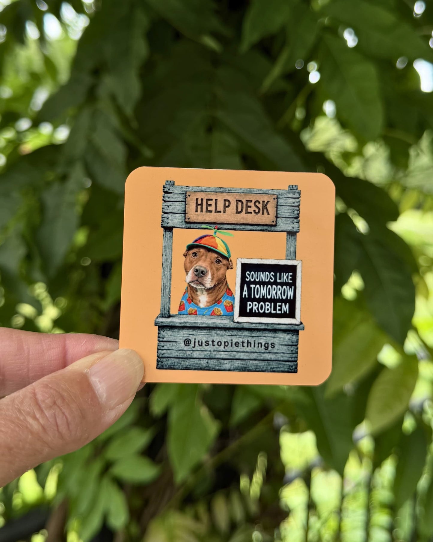 Orange Opie Help Desk magnet (2.5" square) held outdoors, Sounds Like a Tomorrow Problem design featuring Opie the pit bull, aluminum magnet by Sly Dawg Studio