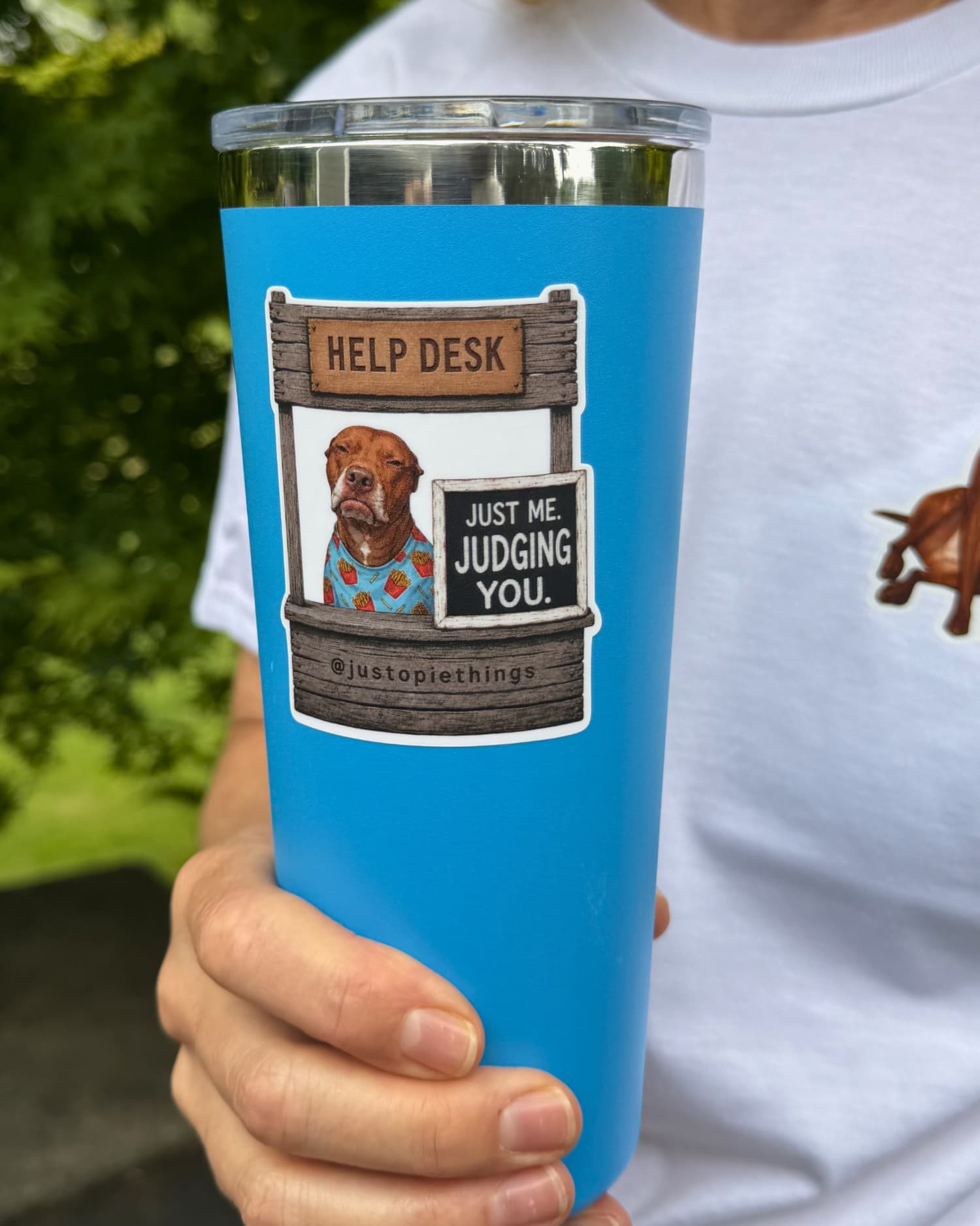 Opie Help Desk stickers, Judging You design applied to a blue stainless steel tumbler held by a person outdoors