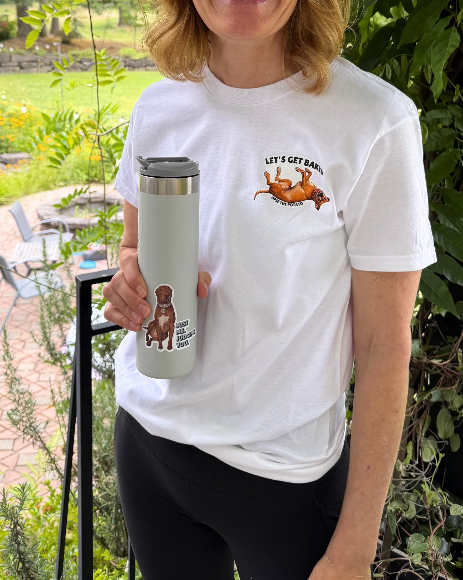 Opie Just Me Judging you sticker on a light gray insulated mug, held by a woman.