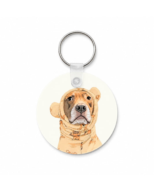 Opie keychain featuring pit bull in teddy bear pajamas, 2 inch round double-sided aluminum keychain with silver split ring, made in the USA by Sly Dawg Studio