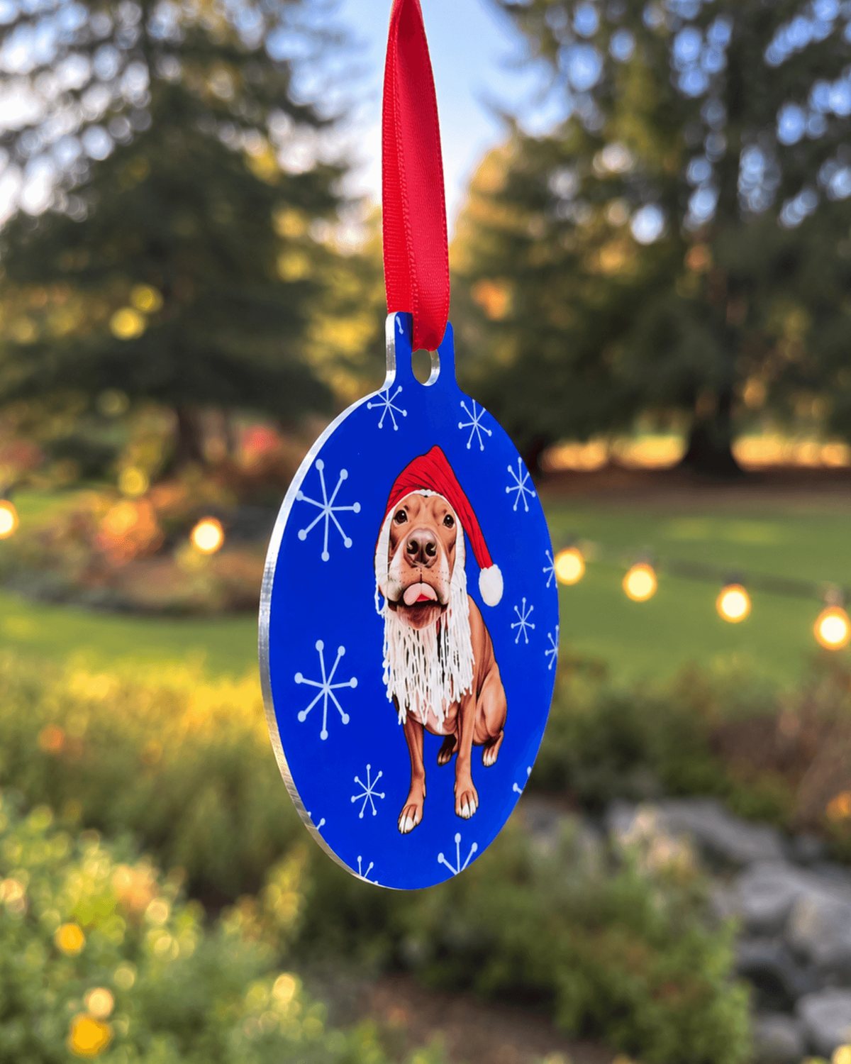 Side view of the Opie pit bull Christmas ornament showing the silver edge and double-sided print