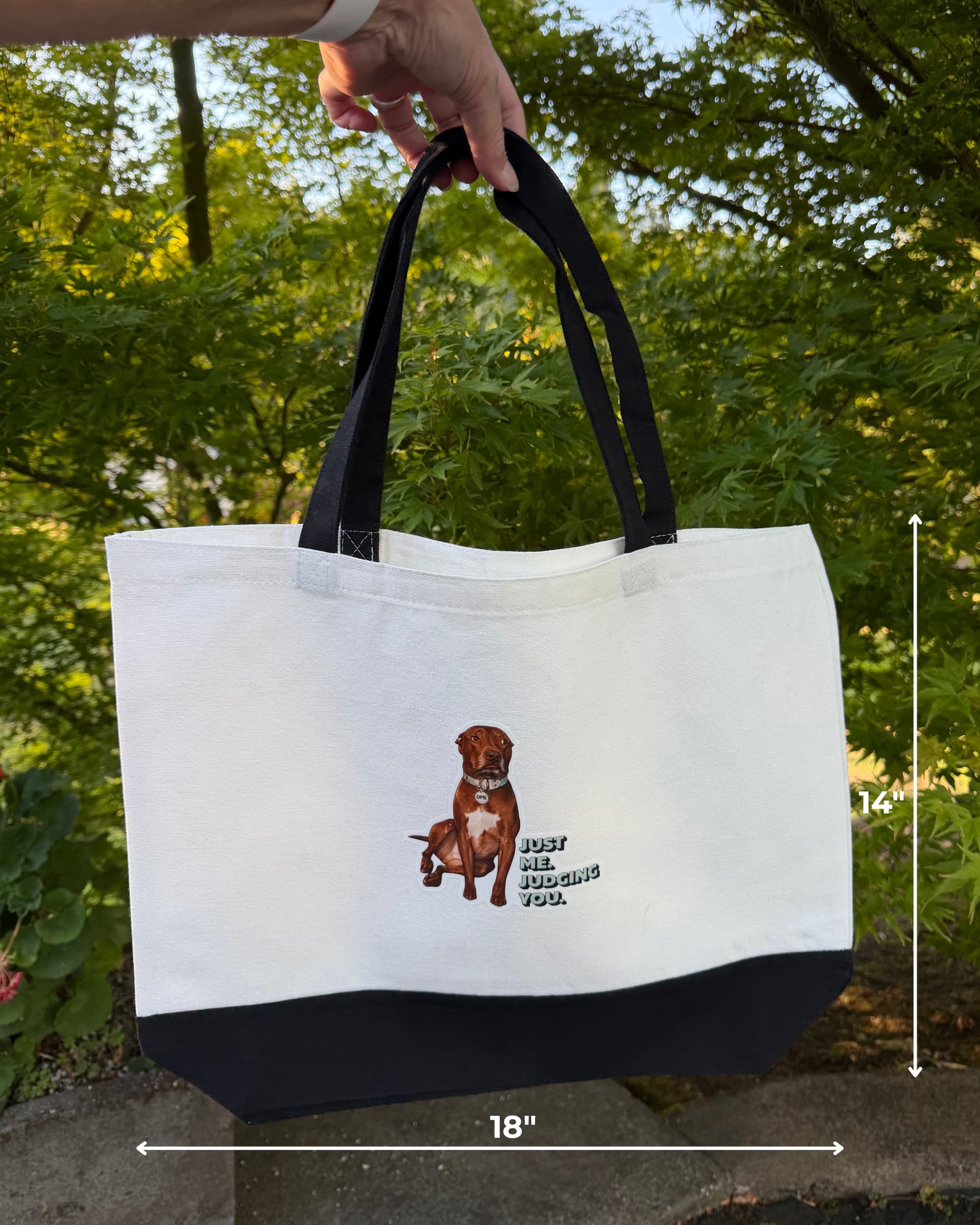 pie tote bag held up outdoors showing dimensions, 18 inches wide by 14 inches tall, Just Me Judging You pit bull canvas tote by Sly Dawg Studio