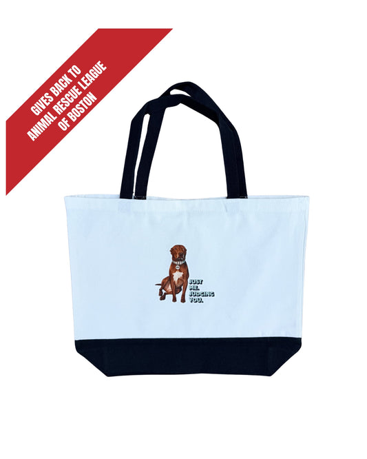 Opie Just Me Judging You canvas tote bag, white with black handles and base, with a banner reading Gives Back to Animal Rescue League of Boston