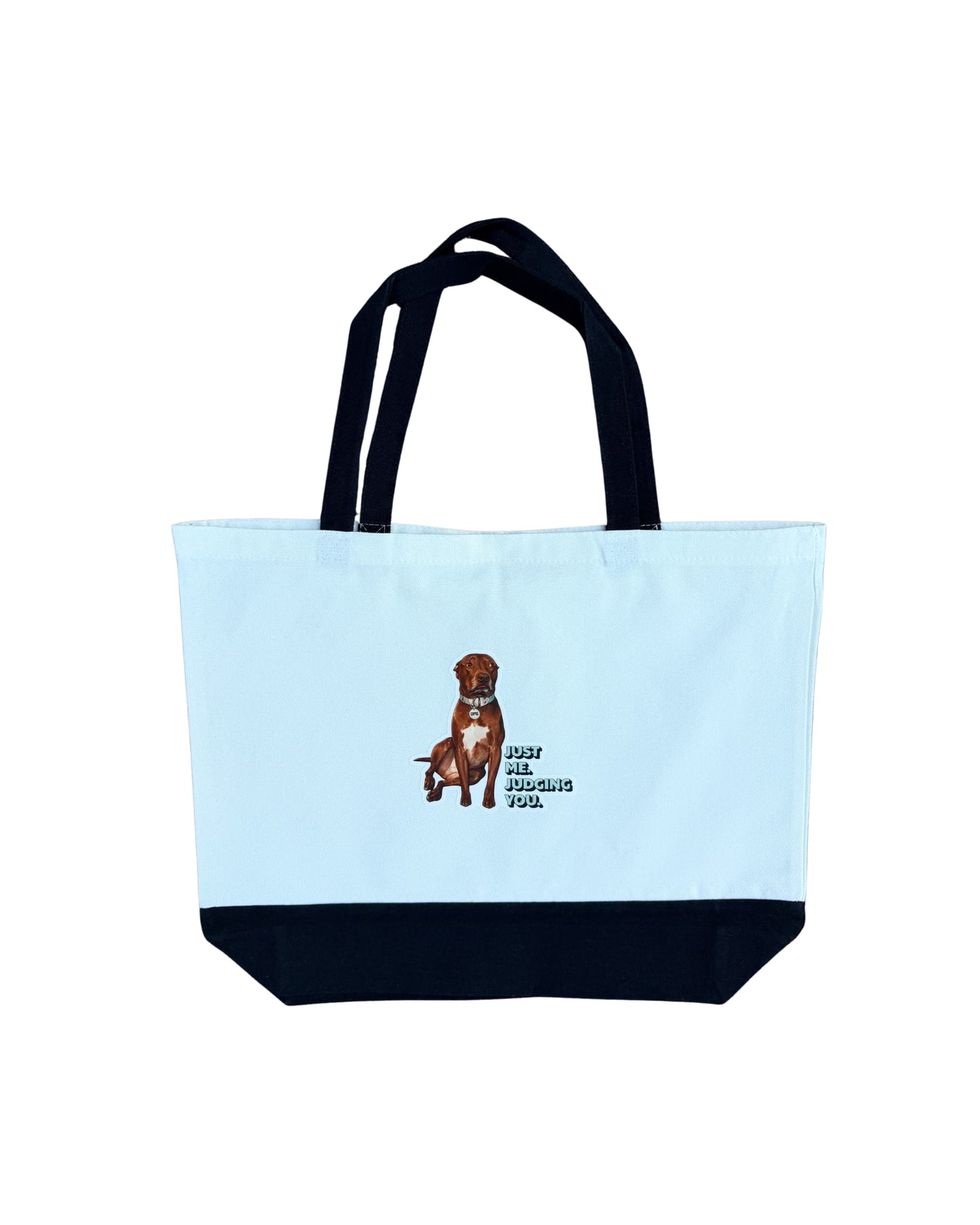 Opie tote bag layflat on white background, Just Me Judging You pit bull graphic on white canvas with black contrast handles and base panel, official @justopiethings merch by Sly Dawg Studio
