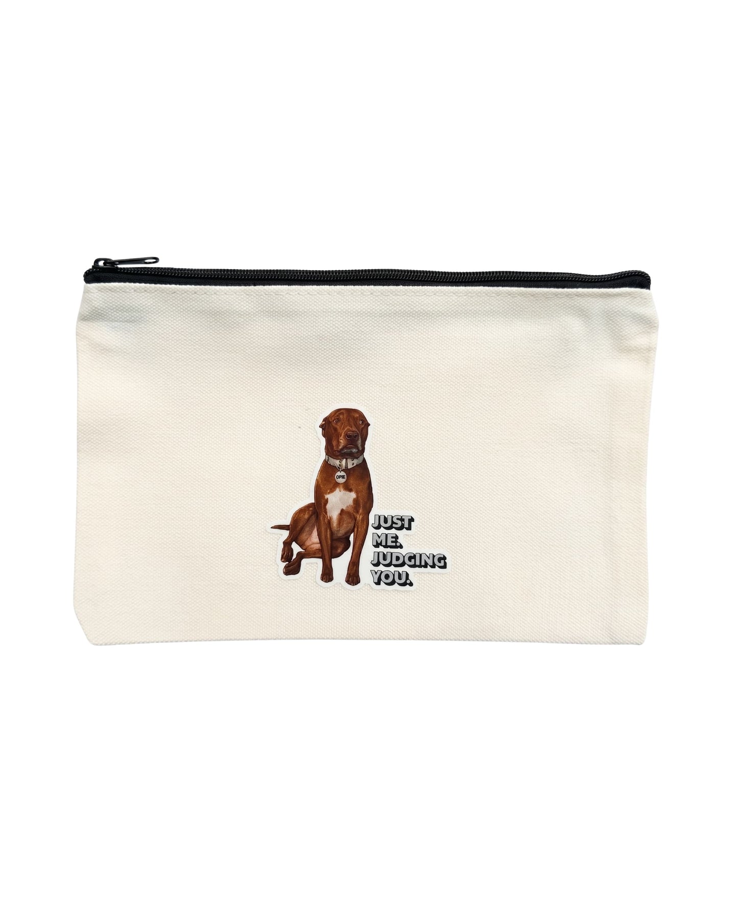 Opie zipper pouch: Beige canvas bag with top zipper. Design of Opie the pit bull with caption "Just me. Judging you." on front. White background.