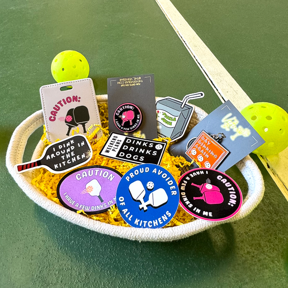 Pickleball gift bsket with luggage tag, pin, keychain, stickers