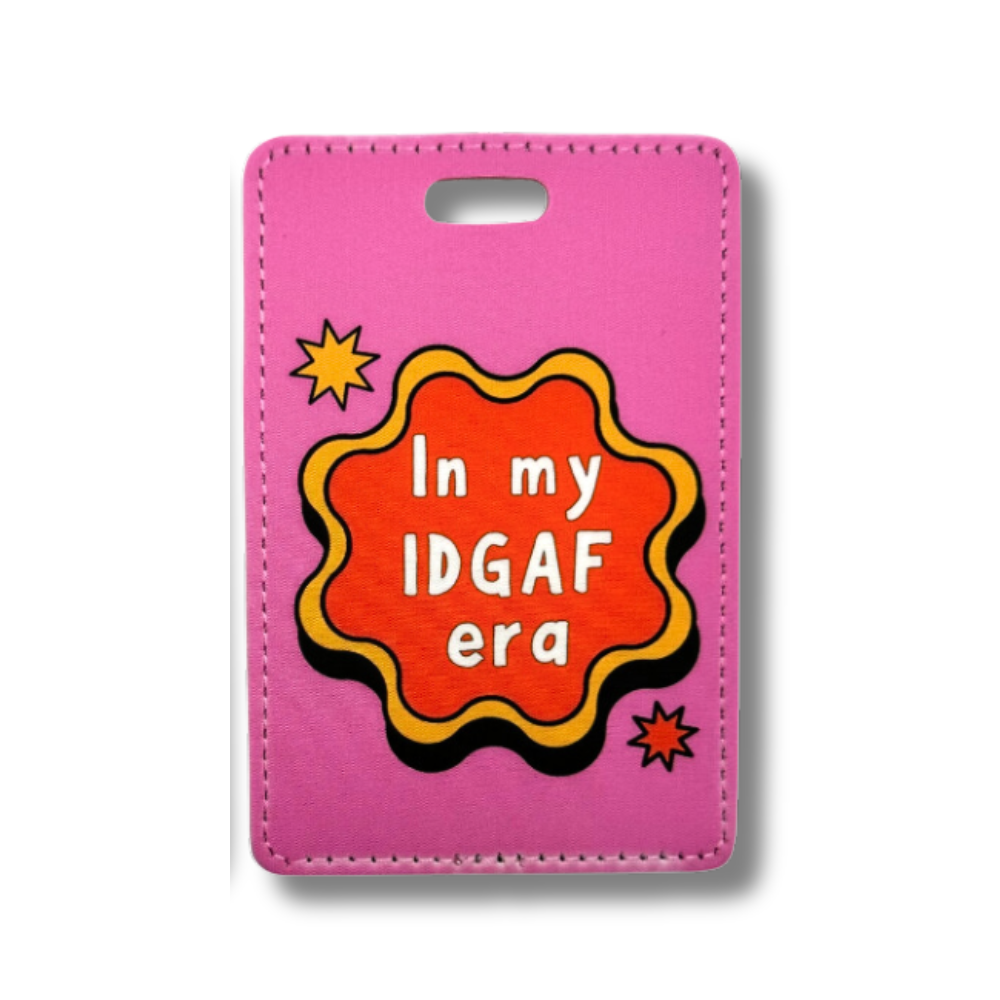 funny travel luggage tag "In my IDGAF era"  hot pink with yellow and red retro wavy circle shape and white letters.
