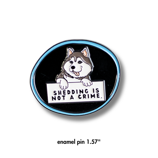 husky enamel pin - black with blue outline. Cartoon husky dog holding sign "shedding is not a crime"