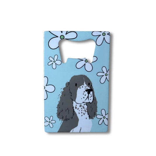 Flat stainless steel Spaniel bottle opener with light blue and white floral background, credit card size for wallet.