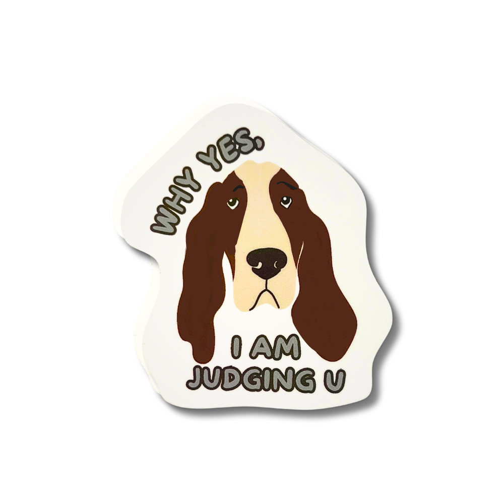 Basset hound sticker with droopy eyes and the text “Why yes, I am judging U” in bold black letters