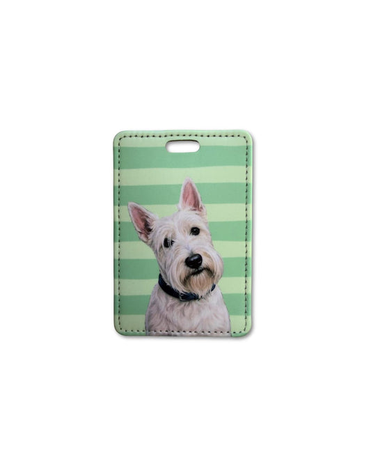 westie luggage tag featuring a white west highland terrier with upright ears on a green striped background