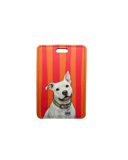 white pit bull luggage tag flat lay showing white bully breed dog with CEO collar tag on orange and pink striped faux leather travel tag